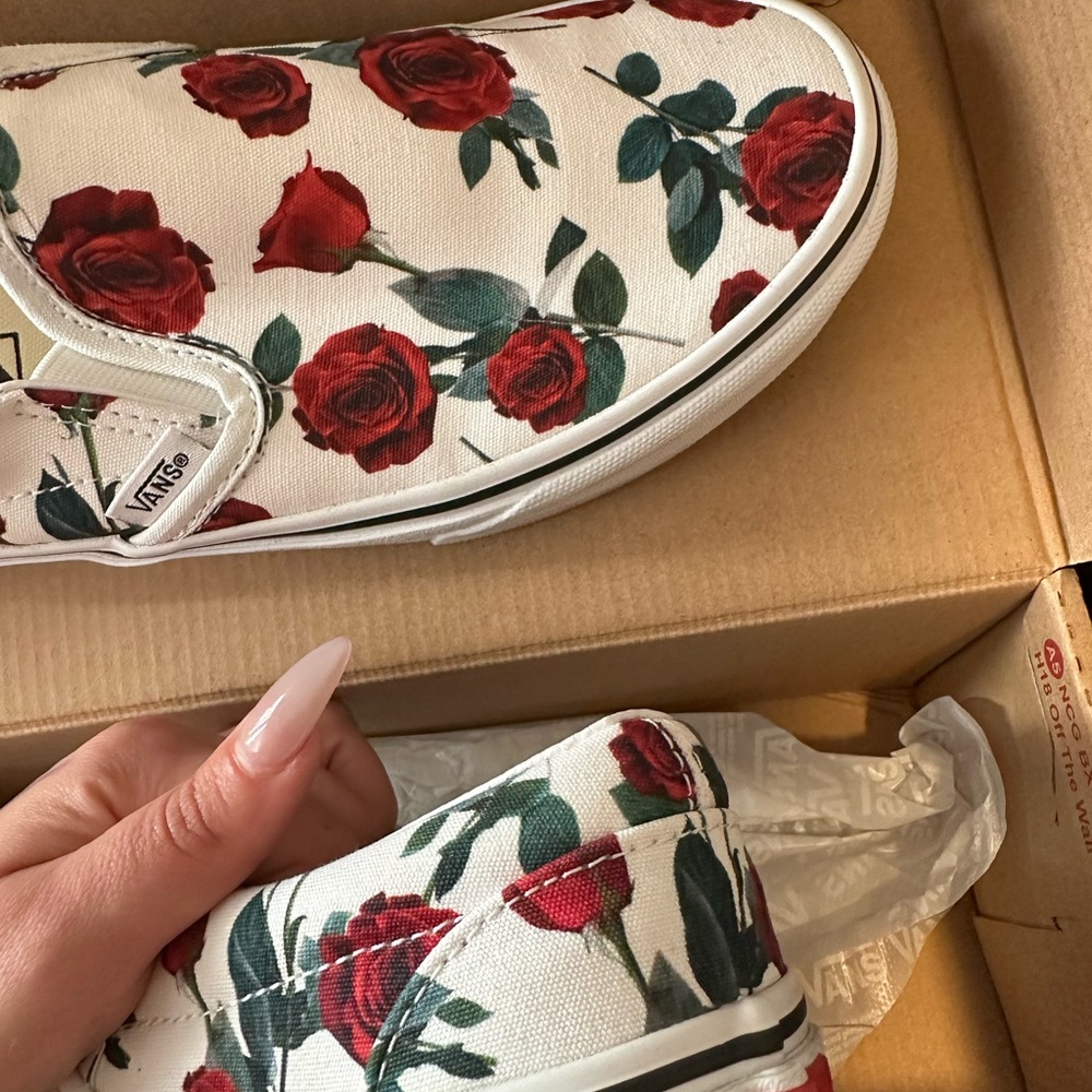 Vans roses on white slip on shoes